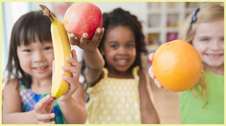 Children holding fruit